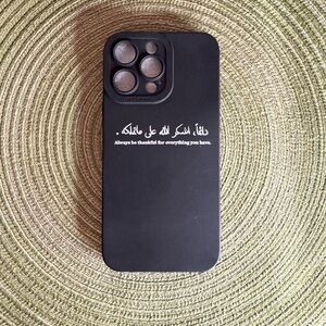 Apple iPhone 15 Pro Max, featuring white text in both Arabic and English.
